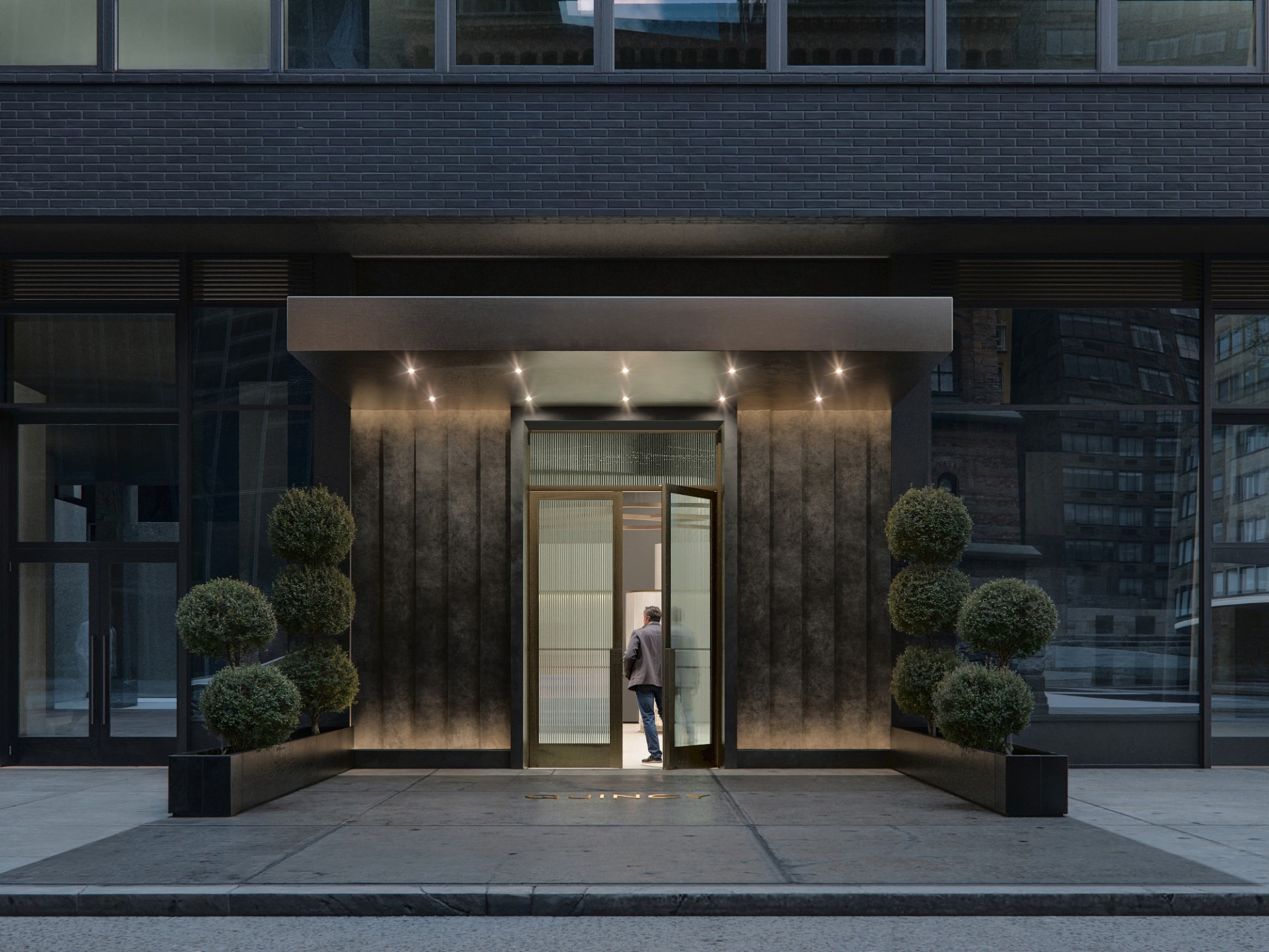 Entrance to Quincy apartments in Midtown Manhattan at 980 6th Avenue.